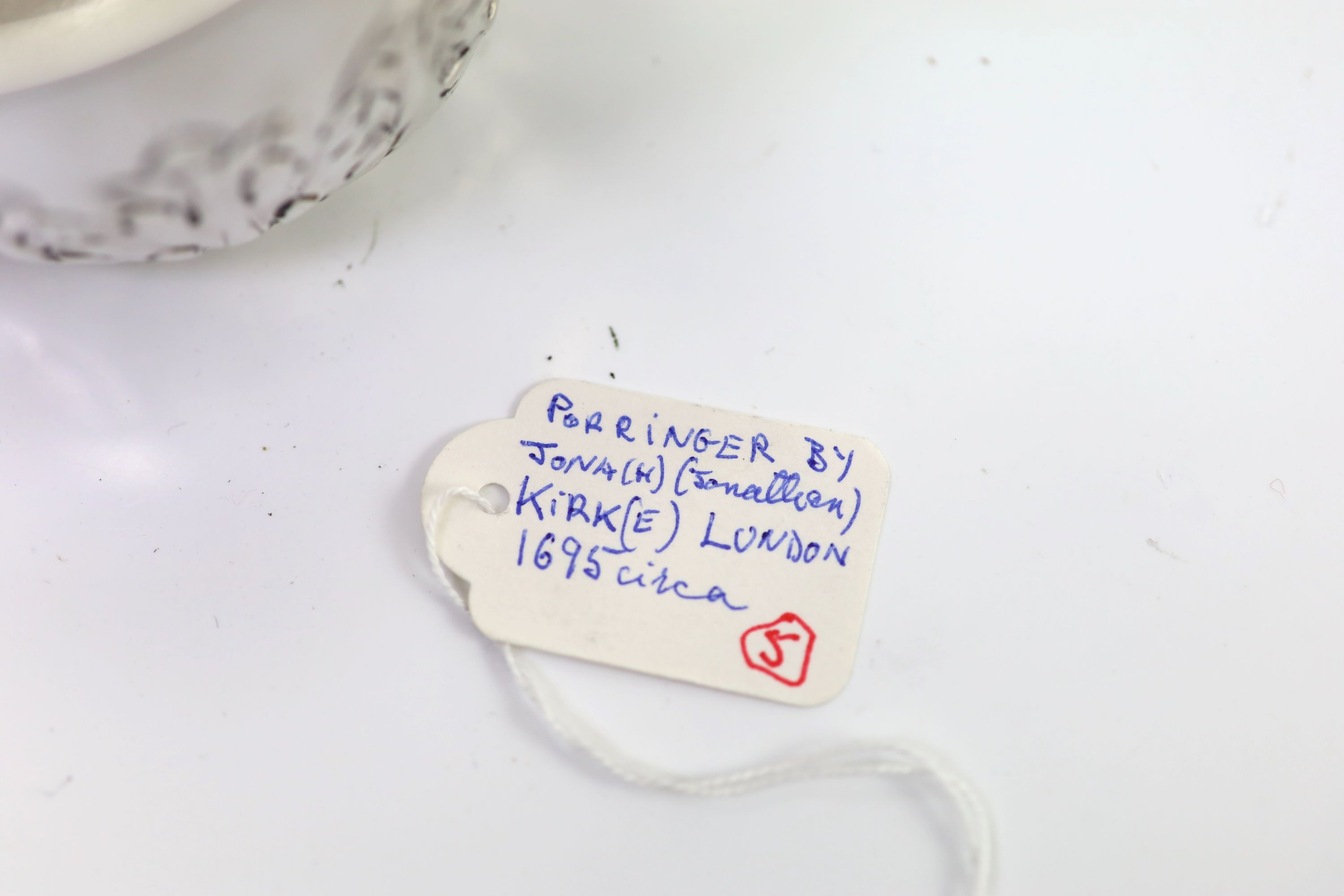 A William III repousse silver porringer, by Jonah Kirk, London c.1695